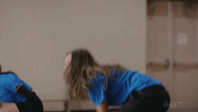 Woman In Blue Shirt Playing Volleyball With Others GIF
