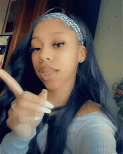 Woman In Blue Shirt Pointing GIF