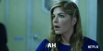 Woman In Blue Shirt Saying Ah Netflix Ad GIF