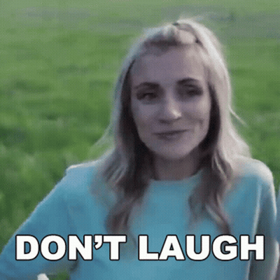 Woman In Blue Shirt Saying Don't Laugh GIF