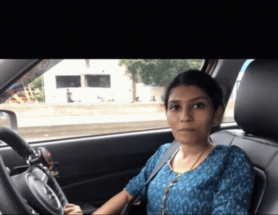 Woman In Blue Shirt Sitting In Car GIF