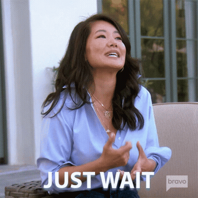 Woman In Blue Shirt Sitting On Couch Just Wait GIF