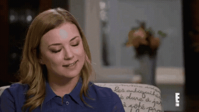 Woman In Blue Shirt Sitting Smiling Eyes Closed GIF