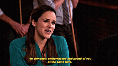 Woman In Blue Shirt Smiling Embarrassed And Proud Of You GIF