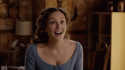 Woman In Blue Shirt Smiling With Mouth Open GIF