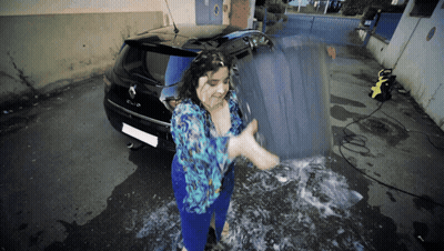 Woman In Blue Shirt Washing Black Renault Clio GIF
