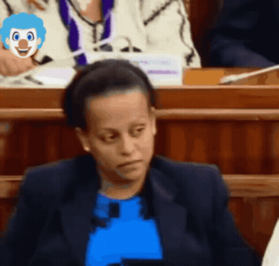 Woman In Blue Shirt With Clown Face On Head GIF