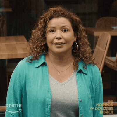 Woman In Blue Shirt With Horror Of Dolores Roach GIF