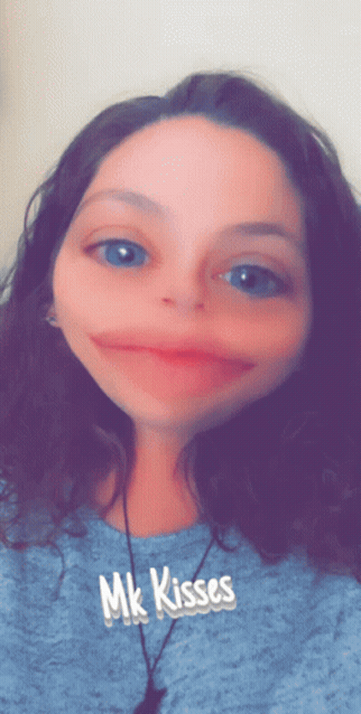 Woman In Blue Shirt With MK Kisses GIF