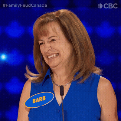 Woman In Blue Shirt With Name Tag GIF