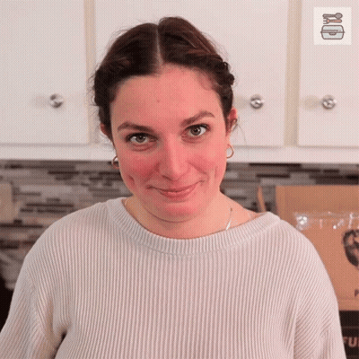 Woman In Blue Shirt With Name Tag GIF