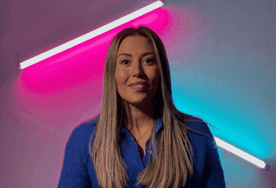Woman In Blue Shirt With Pink And Blue Light GIF