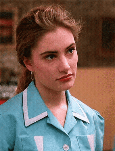 Woman In Blue Shirt With White Trim GIF