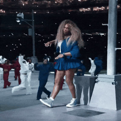 Woman In Blue Skirt And Jacket Dancing GIF