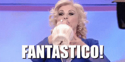 Woman In Blue Suit Blowing Balloon Fantastico GIF