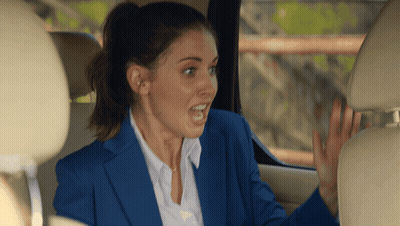 Woman In Blue Suit Sitting In Car GIF