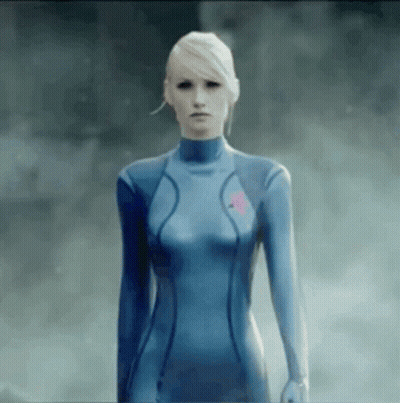 Woman In Blue Suit Standing In Foggy Area GIF