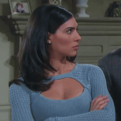 Woman In Blue Sweater Crossing Arms GIF