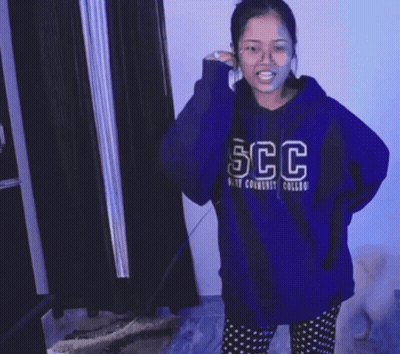 Woman In Blue Sweater Dancing GIF