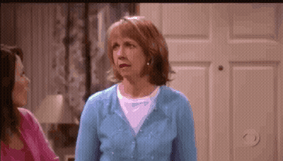 Woman In Blue Sweater Next To Woman In Pink Shirt GIF
