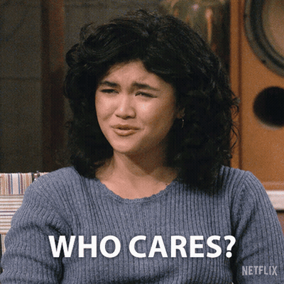 Woman In Blue Sweater Says Who Cares GIF