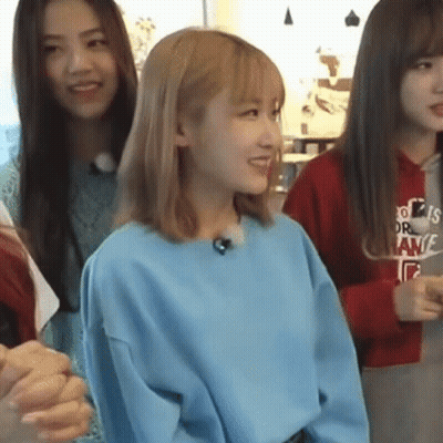 Woman In Blue Sweater Smiling With Two Women GIF