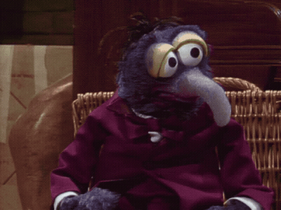 Woman In Blue Sweater Talking About Tuesday GIF