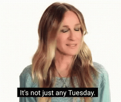 Woman In Blue Sweater Talking About Tuesday GIF