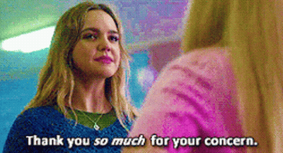 Woman In Blue Sweater Talking To Woman In Pink Sweater GIF