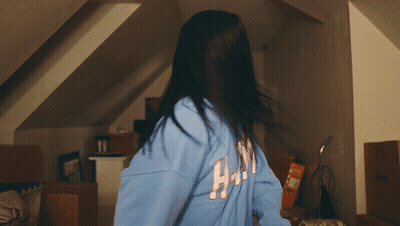Woman In Blue Sweatshirt Saying HM GIF