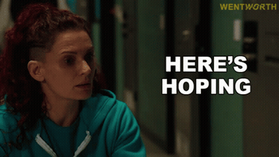 Woman In Blue Sweatshirt Says Here's Hoping GIF