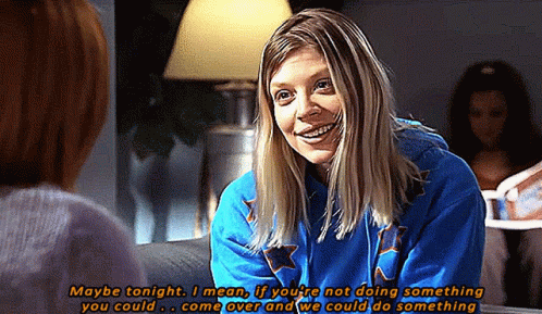 Woman In Blue Sweatshirt Talking To Another Woman GIF