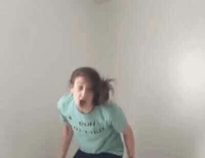 Woman In Blue T-Shirt Jumping GIF
