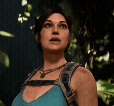 Woman In Blue Tank Top And Green Necklace Looking Up GIF