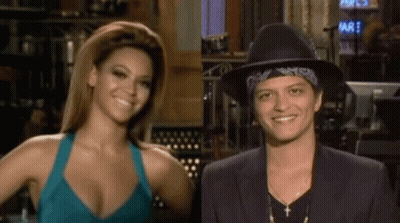 Woman In Blue Tank Top And Man In Black Hat Smiling GIF