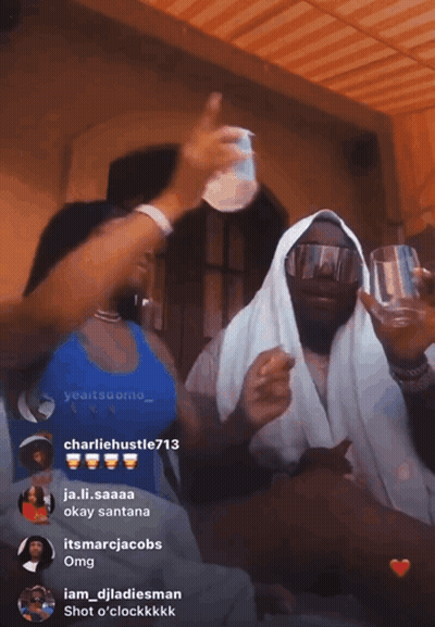 Woman In Blue Tank Top Next To Man In White Robe GIF
