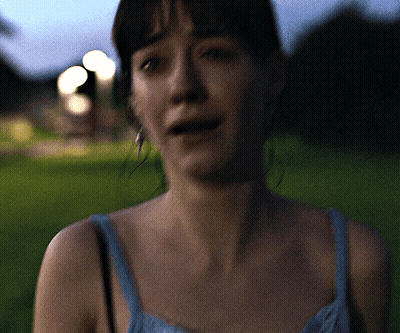 Woman In Blue Tank Top Standing In Grass GIF