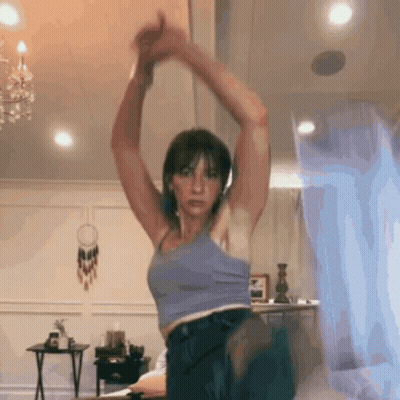Woman In Blue Tank Top Stretching GIF