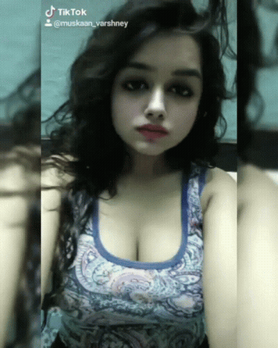 Woman In Blue Tank Top With TikTok Account GIF