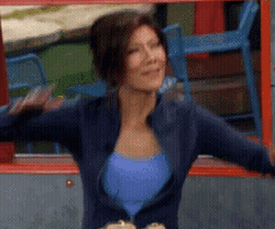 Woman In Blue Top And Jacket Dancing GIF