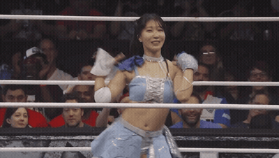 Woman In Blue Top And Silver Skirt Boxing Ring GIF