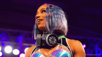 Woman In Blue Top And Silver Skirt In Boxing Ring GIF