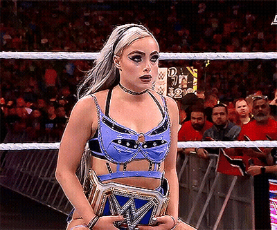 Woman In Blue Top Holding Wrestling Championship Belt GIF