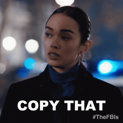 Woman In Blue Turtleneck Saying Copy That GIF