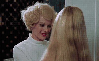 Woman In Blue Wig And Purple Gloves GIF