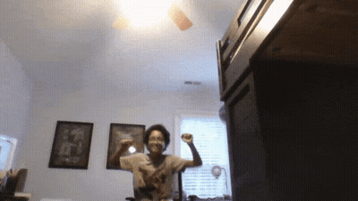 Woman In Blue Wig And White Tank Top GIF