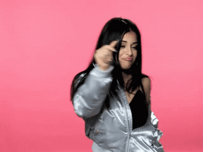 Woman In Bomber Jacket Making Funny Face GIF