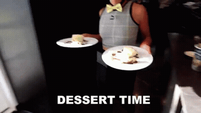 Woman In Bow Tie Carrying Dessert Plates Saying Dessert Time GIF