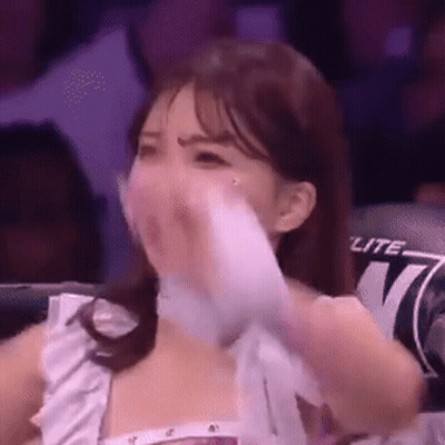 Woman In Boxing Ring Covering Mouth With Towel GIF