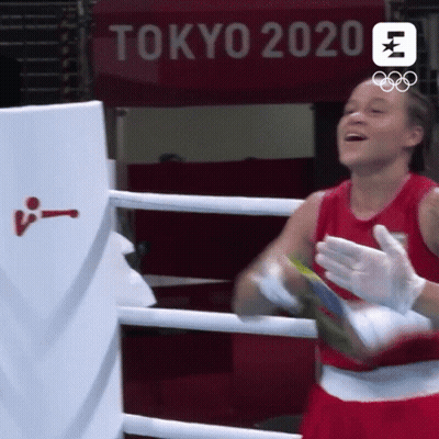 Woman In Boxing Ring With Tokyo 2020 Sign GIF